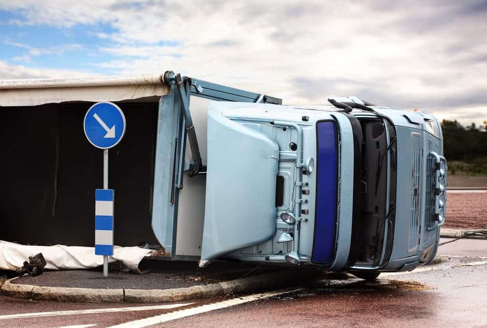 Overturned truck on the road.
